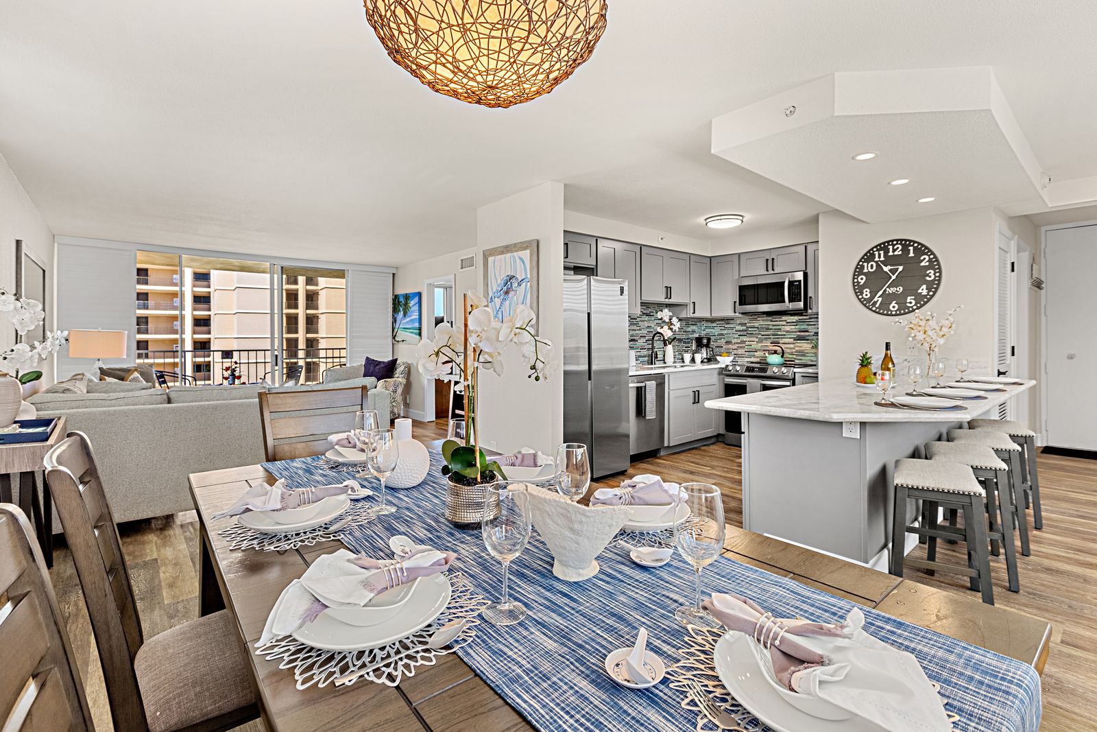 Your spacious open-concept haven flows seamlessly from dining to kitchen, with modern appliances and coastal touches creating the perfect gathering space.