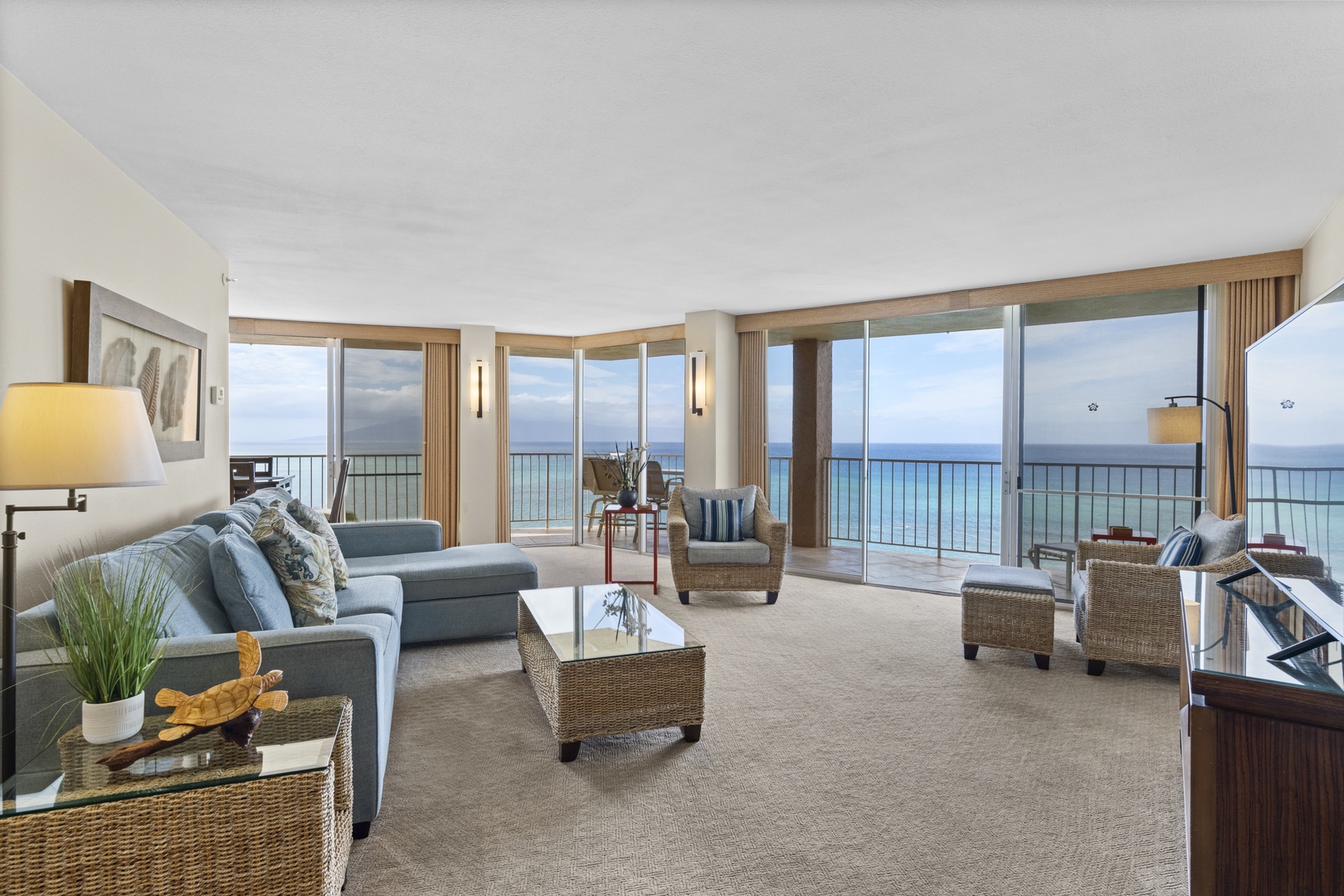 Unwind in this stunning oceanfront living room where floor-to-ceiling windows frame endless sea views and coastal breezes fill your tranquil retreat.
