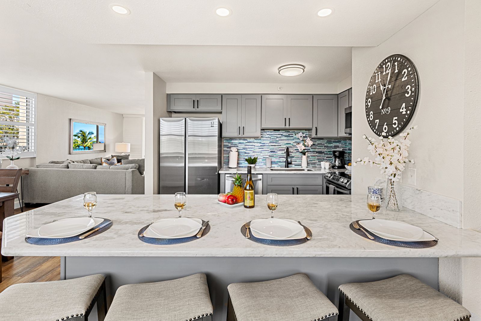 Gather around this stunning marble island where you'll create memories over home-cooked meals and morning coffee in your fully equipped kitchen.