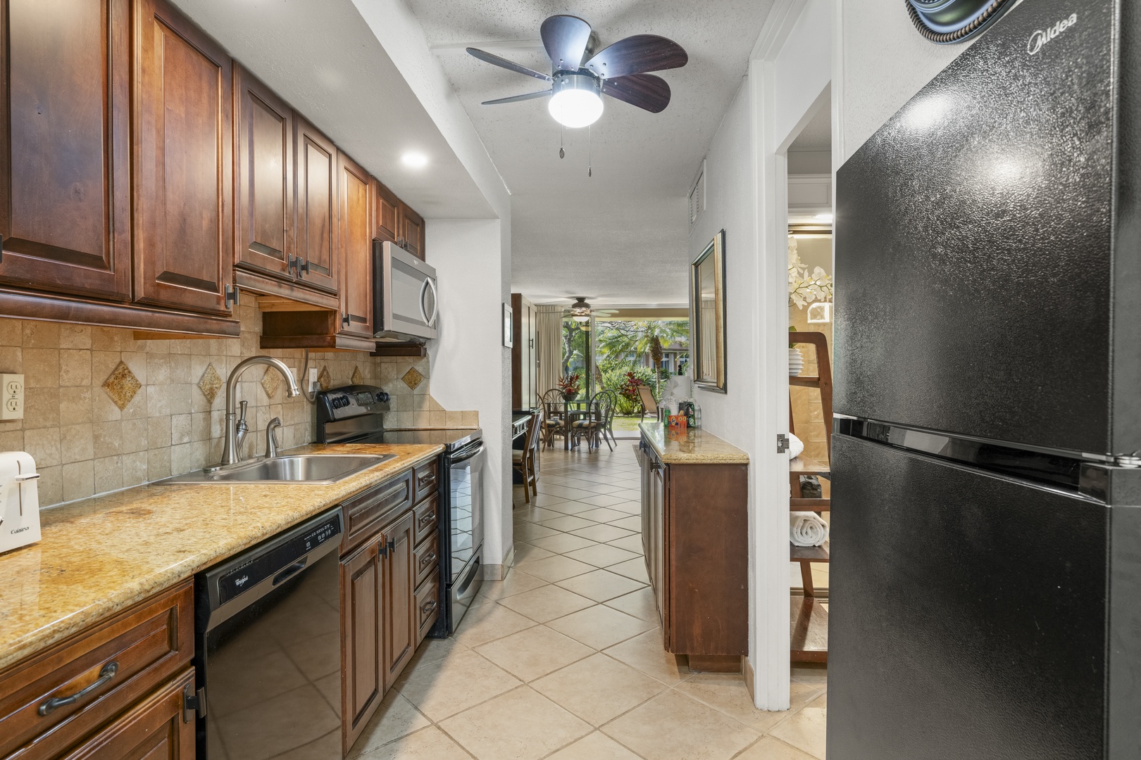 Your fully equipped kitchen features granite countertops, elegant wood cabinetry, and all the appliances you need to prepare favorite meals during your stay.