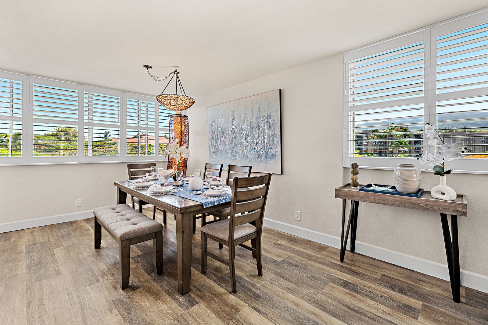 Your bright dining room features elegant furnishings and plantation shutters that frame peaceful neighborhood views while you enjoy memorable meals.