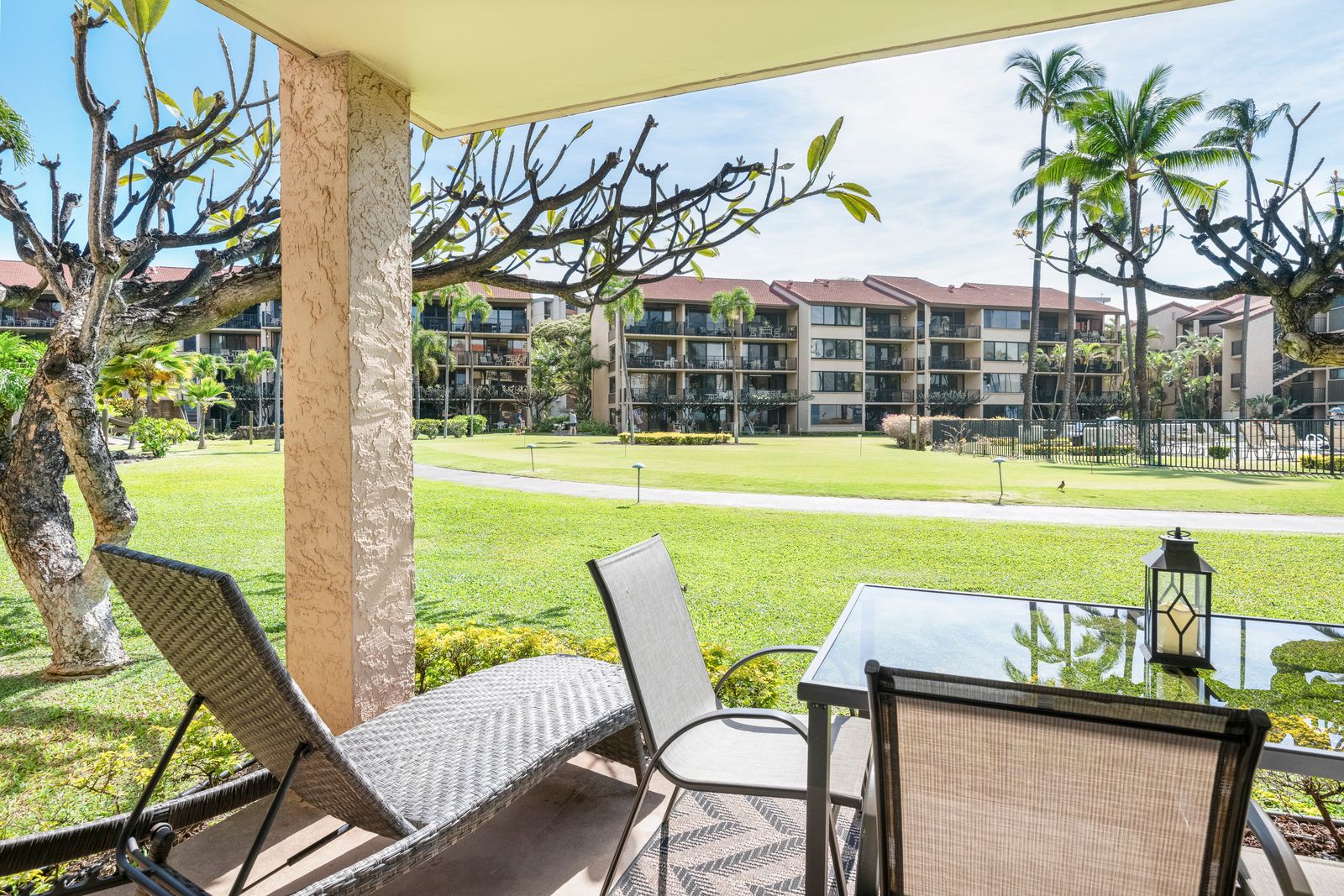 Relax on your private lanai with peaceful views of manicured lawns, swaying palms, and tropical gardens—perfect for morning coffee or sunset cocktails.