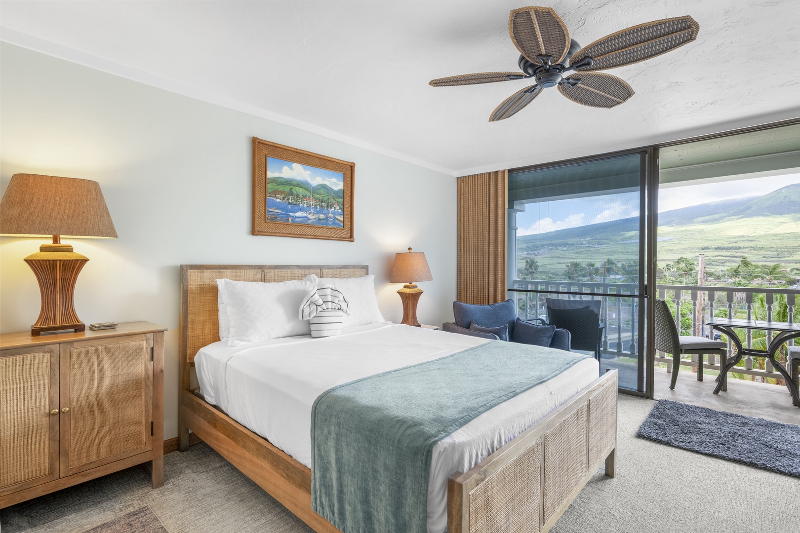 Wake up to breathtaking mountain vistas from your serene bedroom retreat. Relax in coastal-inspired comfort with island decor, plush bedding, and your private balcony where endless views await.