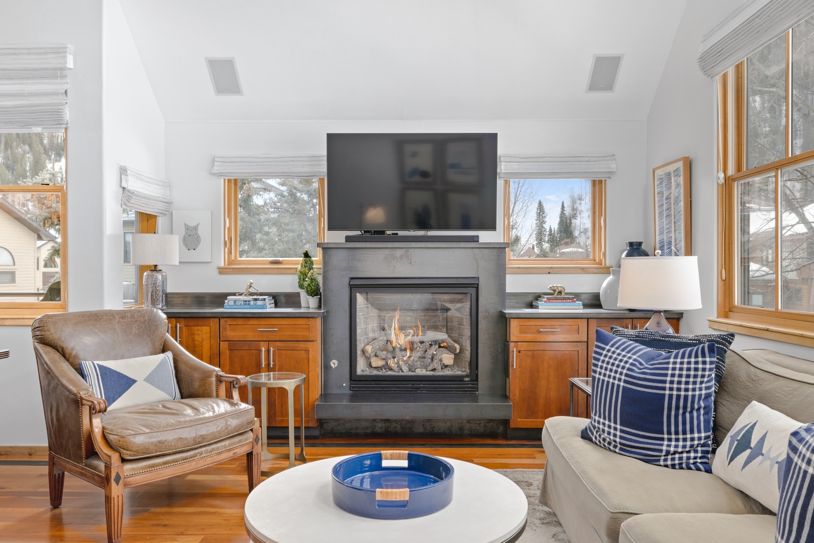 The spacious living room has vaulted ceilings and a gas fireplace