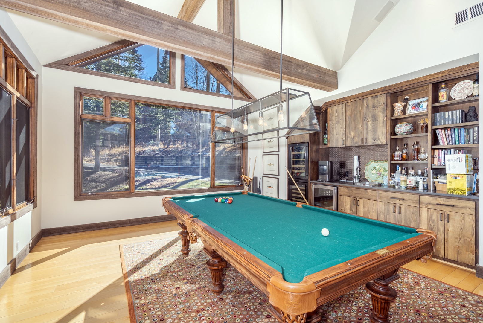 Open concept living room with pool table and bar