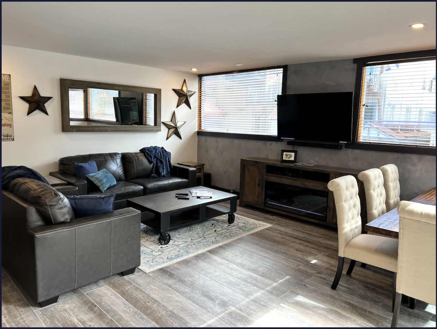 Spacious living room with electric fireplace and smart TV