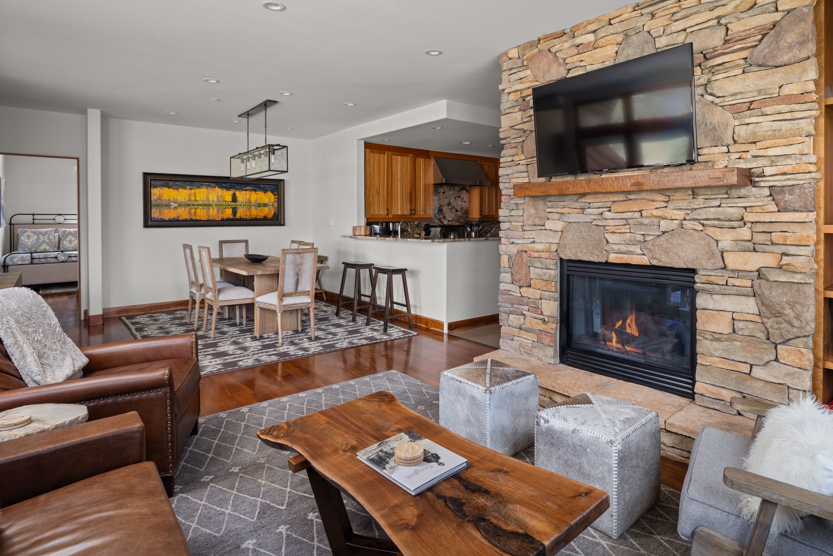 Open concept living room with smart TV and gas fireplace