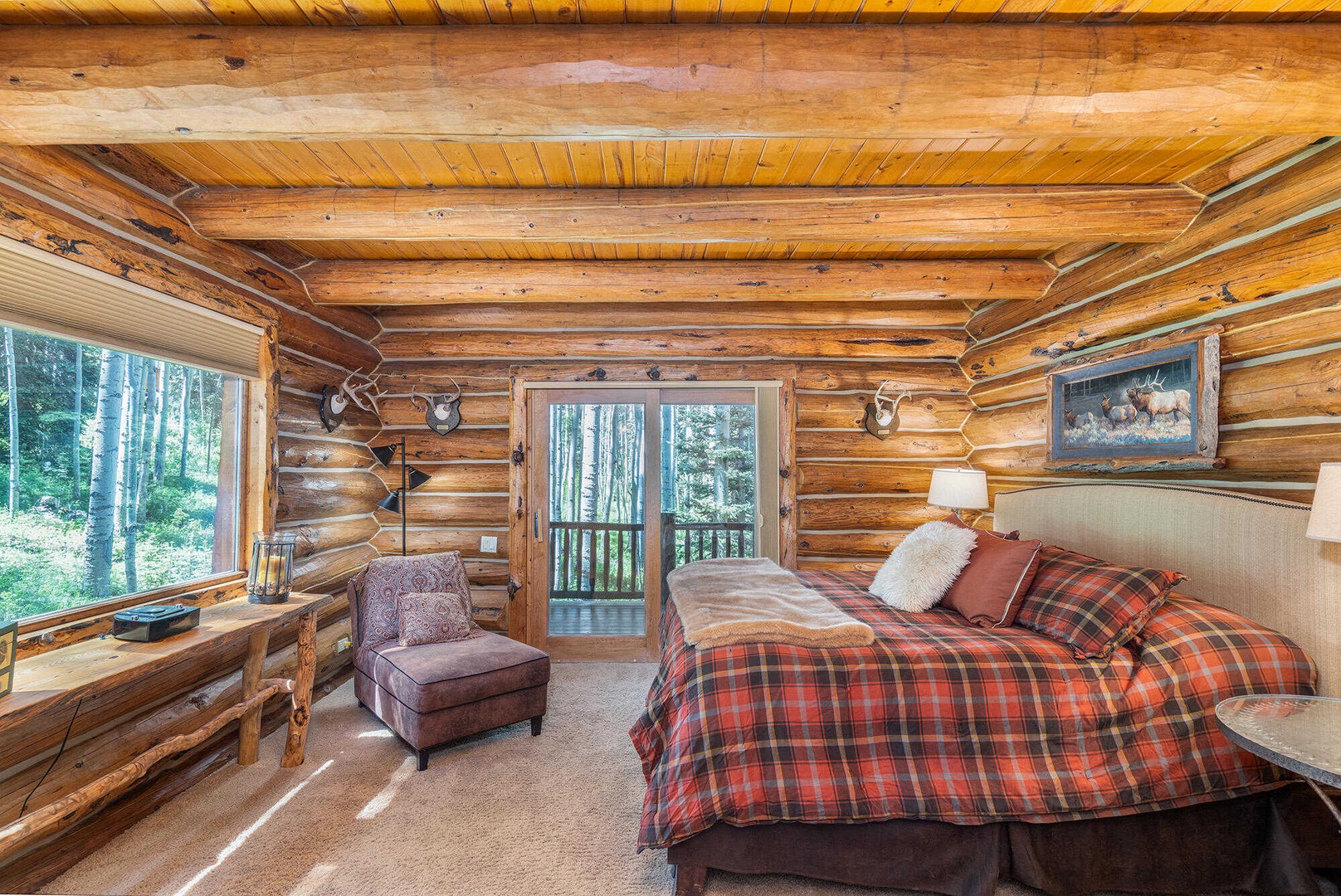 Bedroom 1 - Primary Bedroom - Main Level - King sized bed, deck access and ensuite bathroom