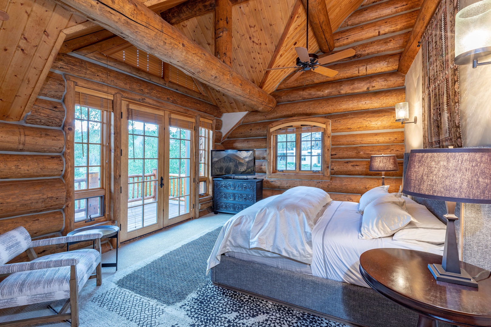 Bedroom 1 - Primary Bedroom with king bed, private deck, air conditioning and ensuite bathroom