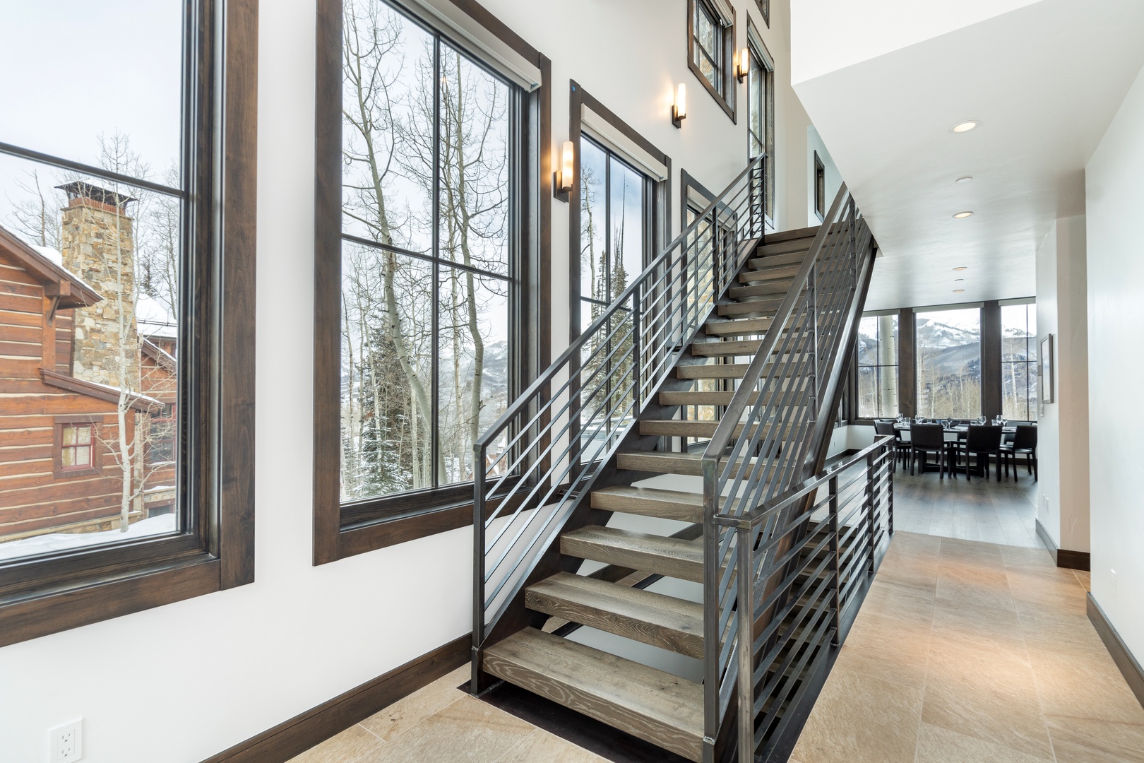 Amazing architectural details like this staircase highlight this home