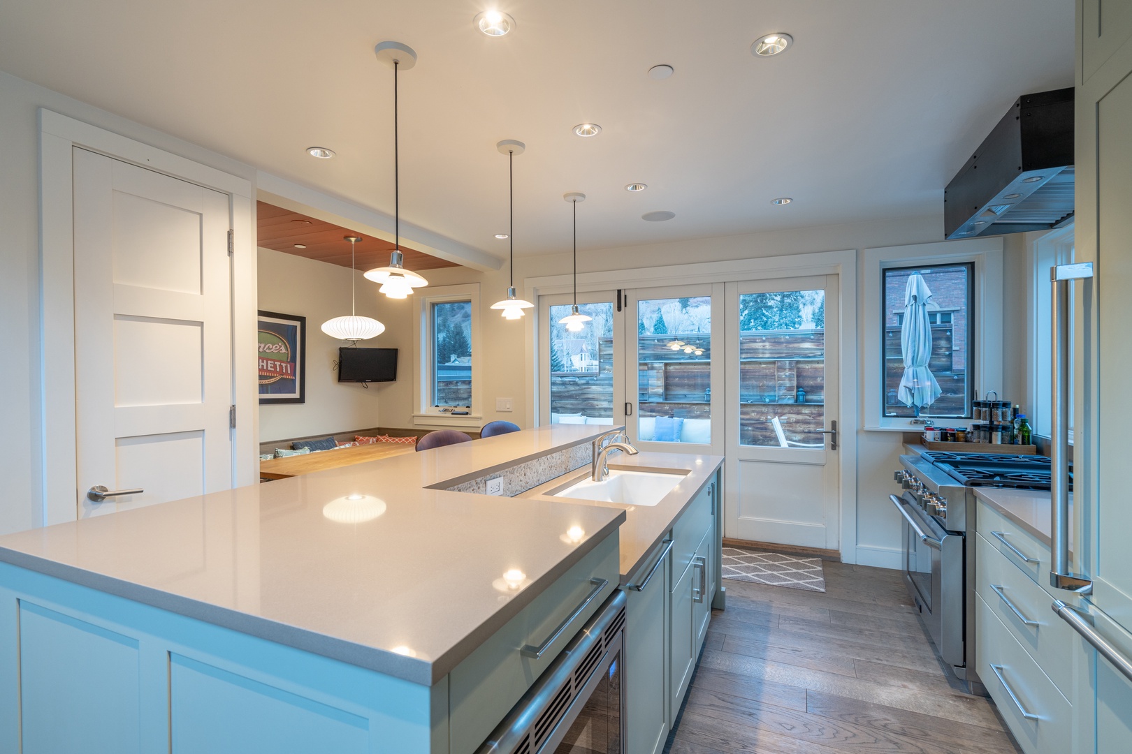 Tiered kitchen area flows directly to the north side deck and BBQ