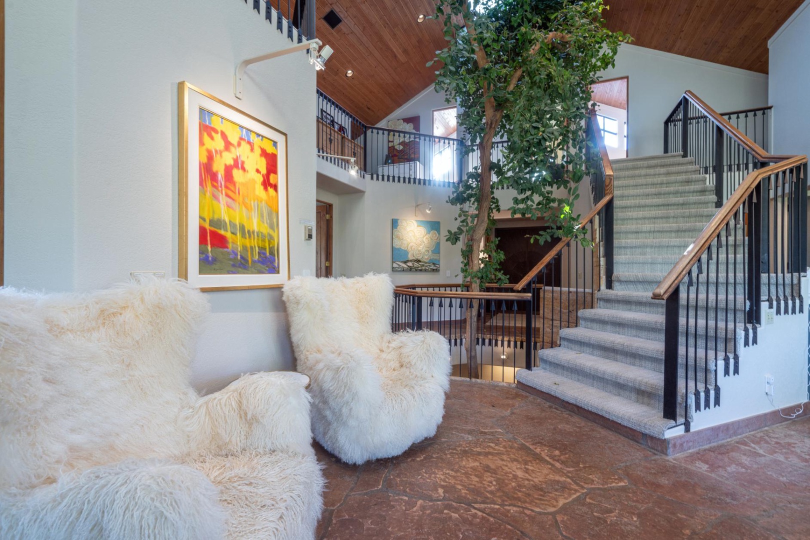 Living Room - Cozy seating near 40 foot ficus tree at the center of the house
