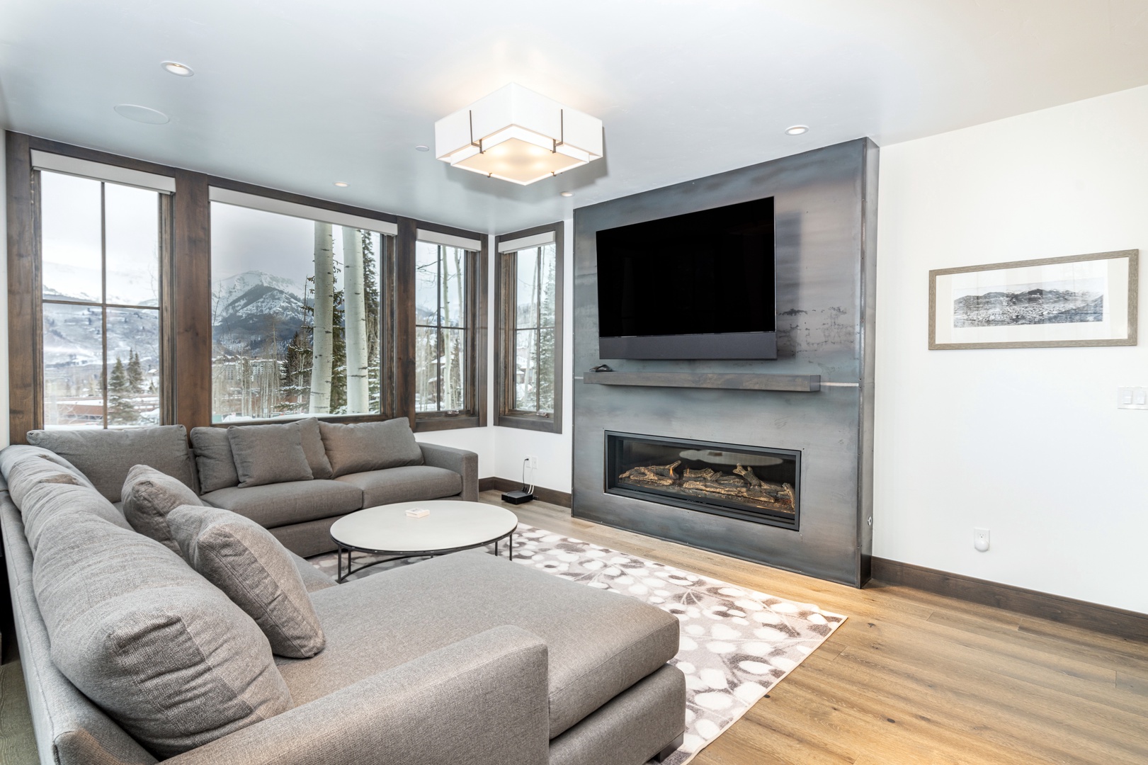Comfy and modern gas fireplace and huge smart TV