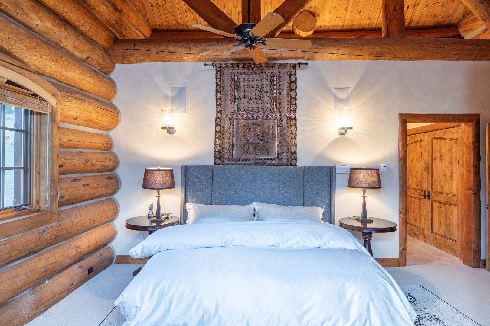 Bedroom 1 - Primary Bedroom with king bed, private deck, air conditioning and ensuite bathroom