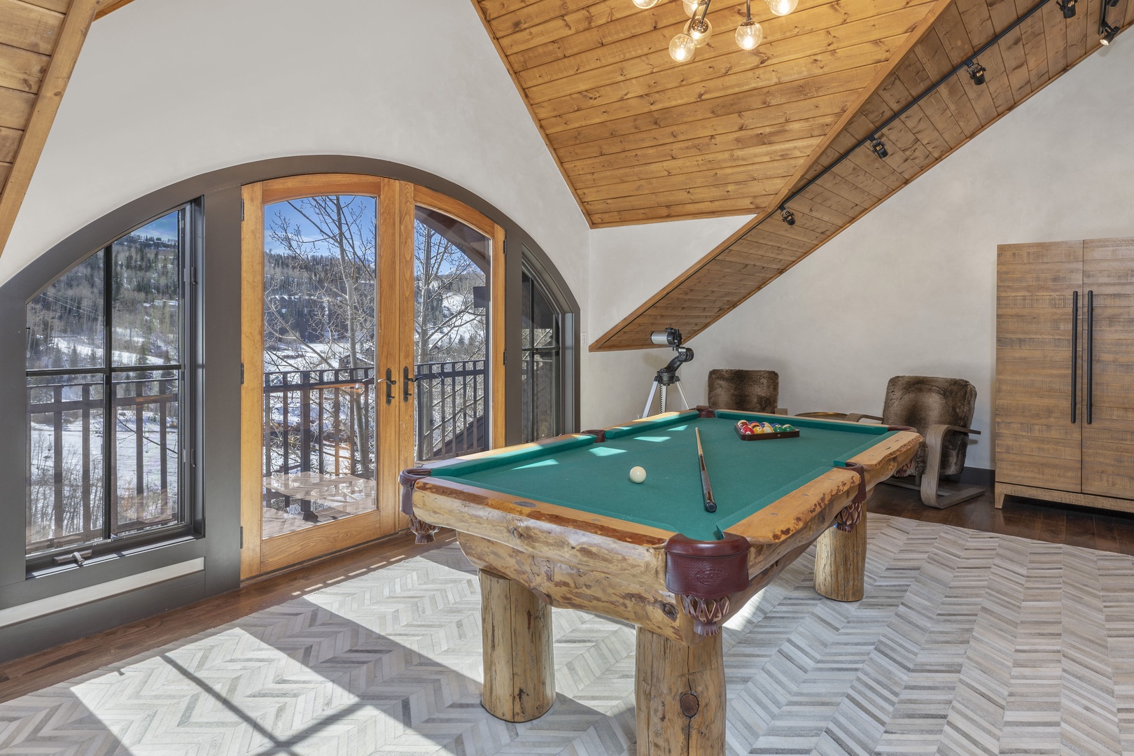 Billiards room with a balcony