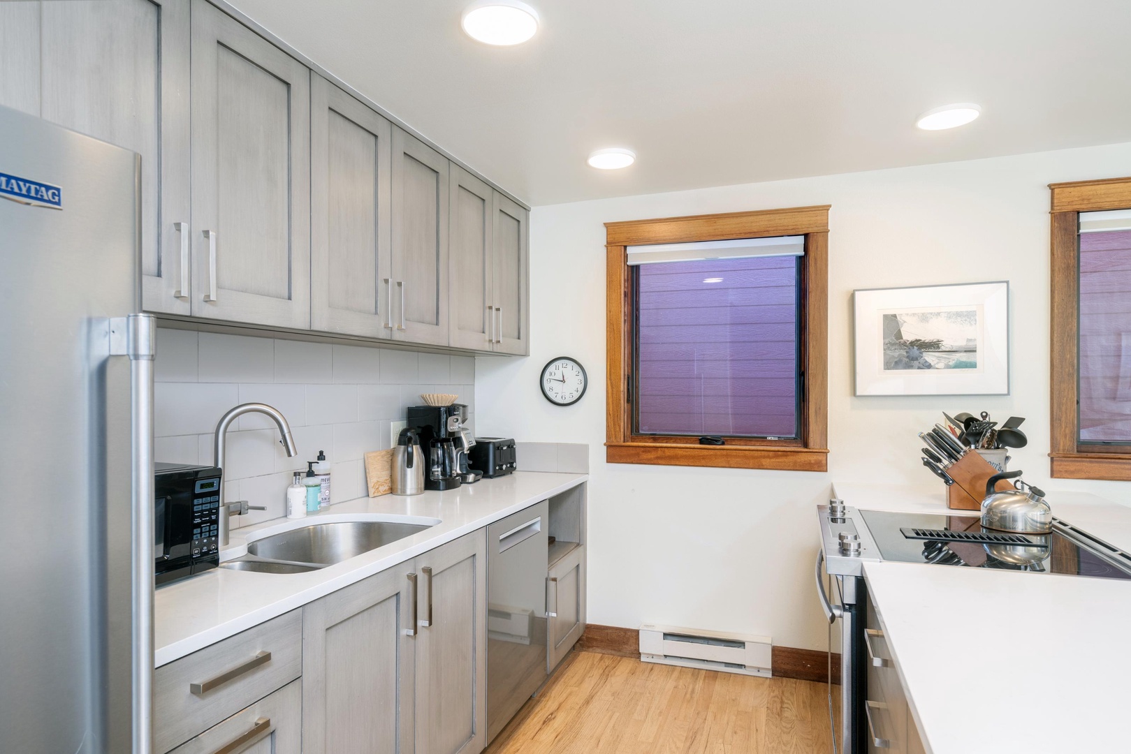 Kitchen looks out to the living room and dining