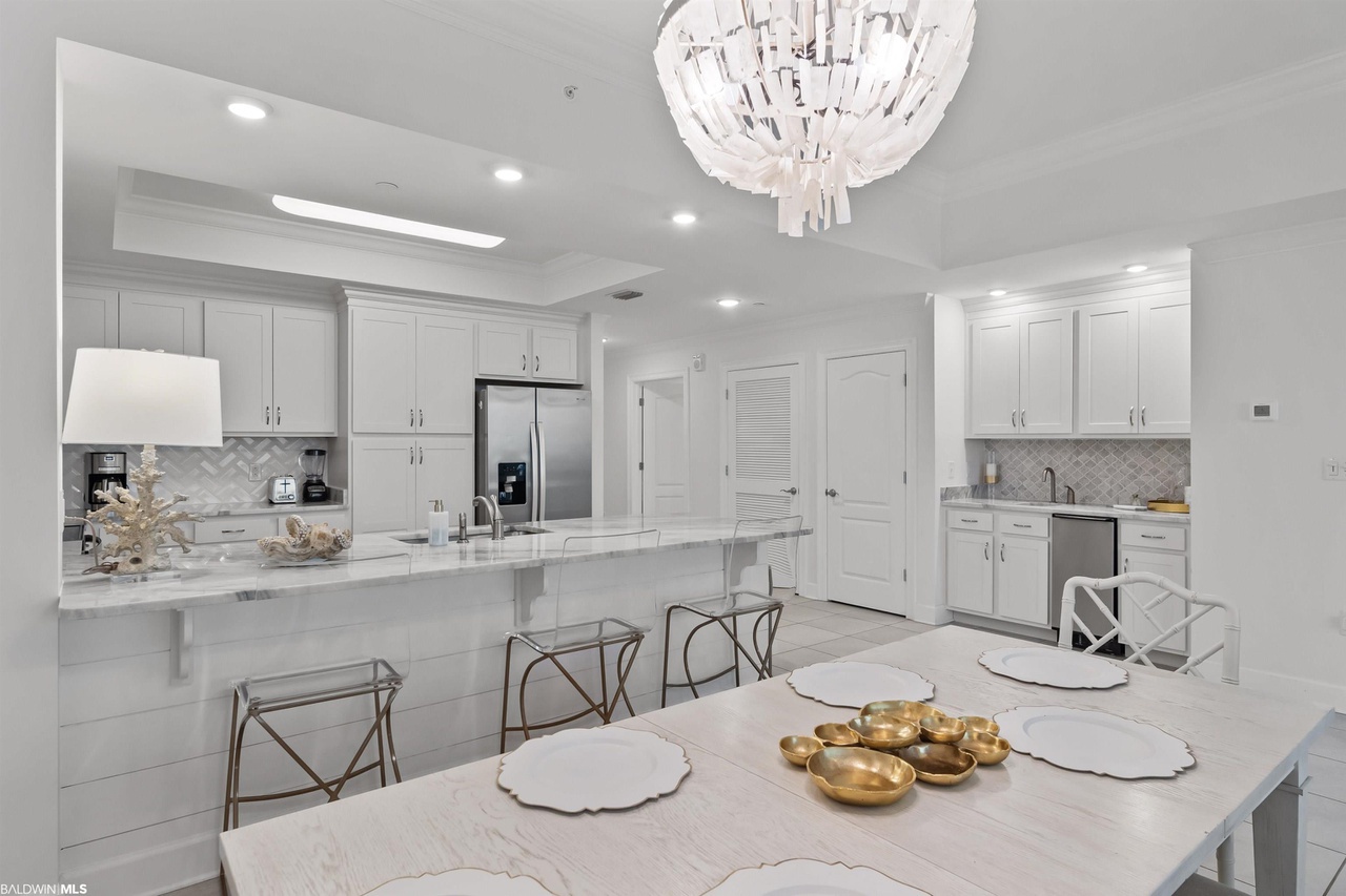 Dining area off kitchen with view of wet bar