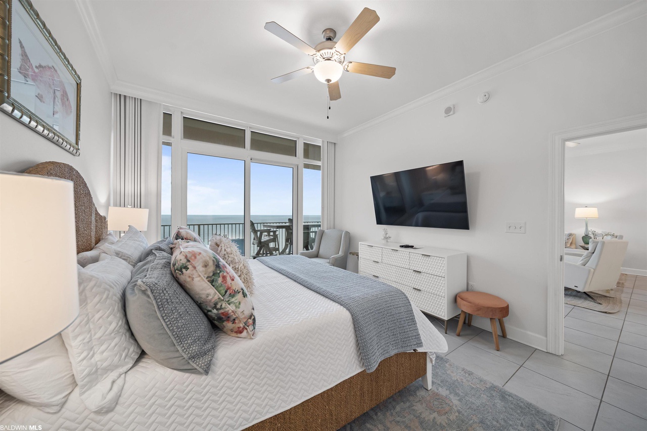 Primary bedroom with flat screen TV