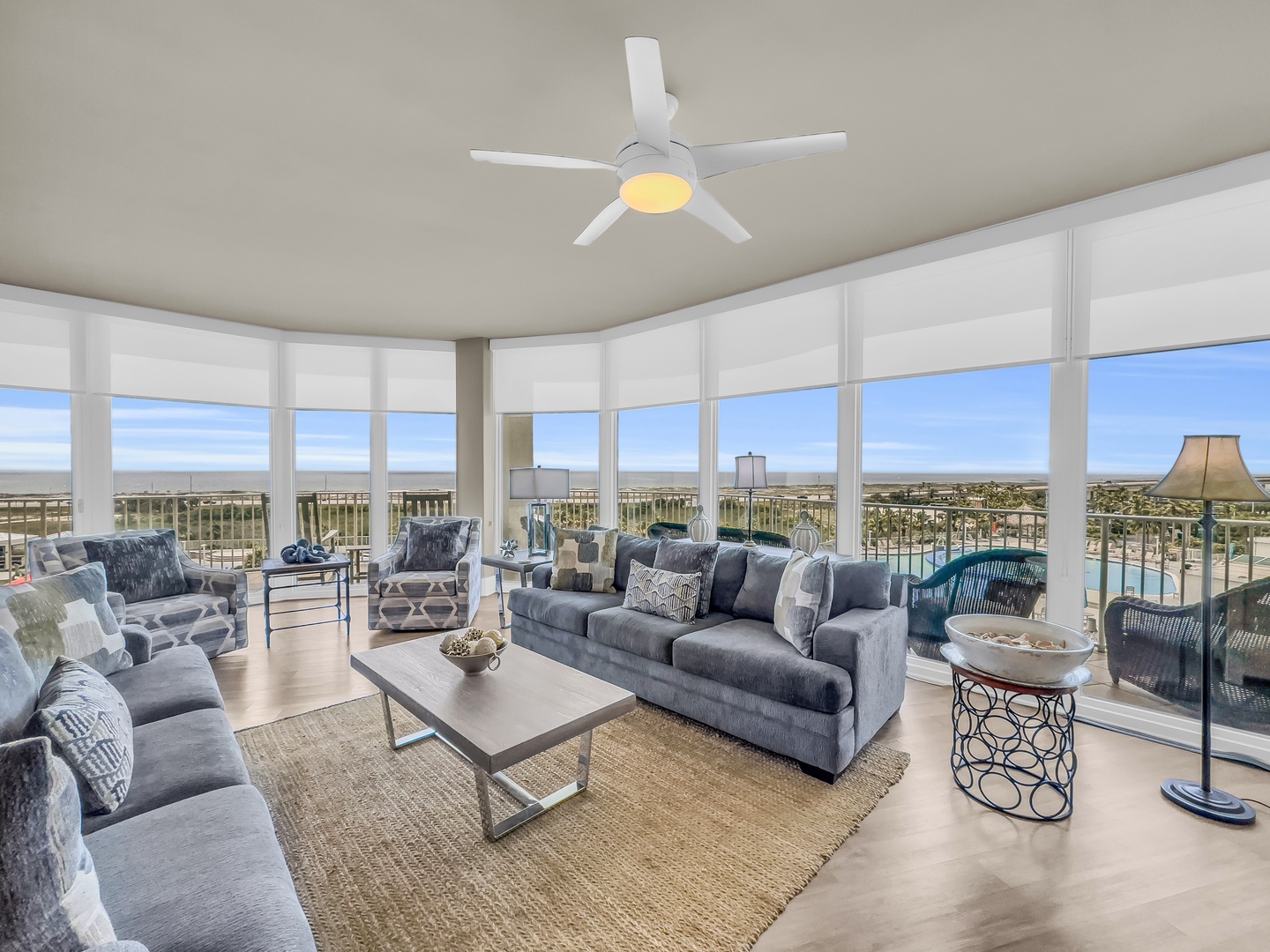 Living room with ample seating and balcony access