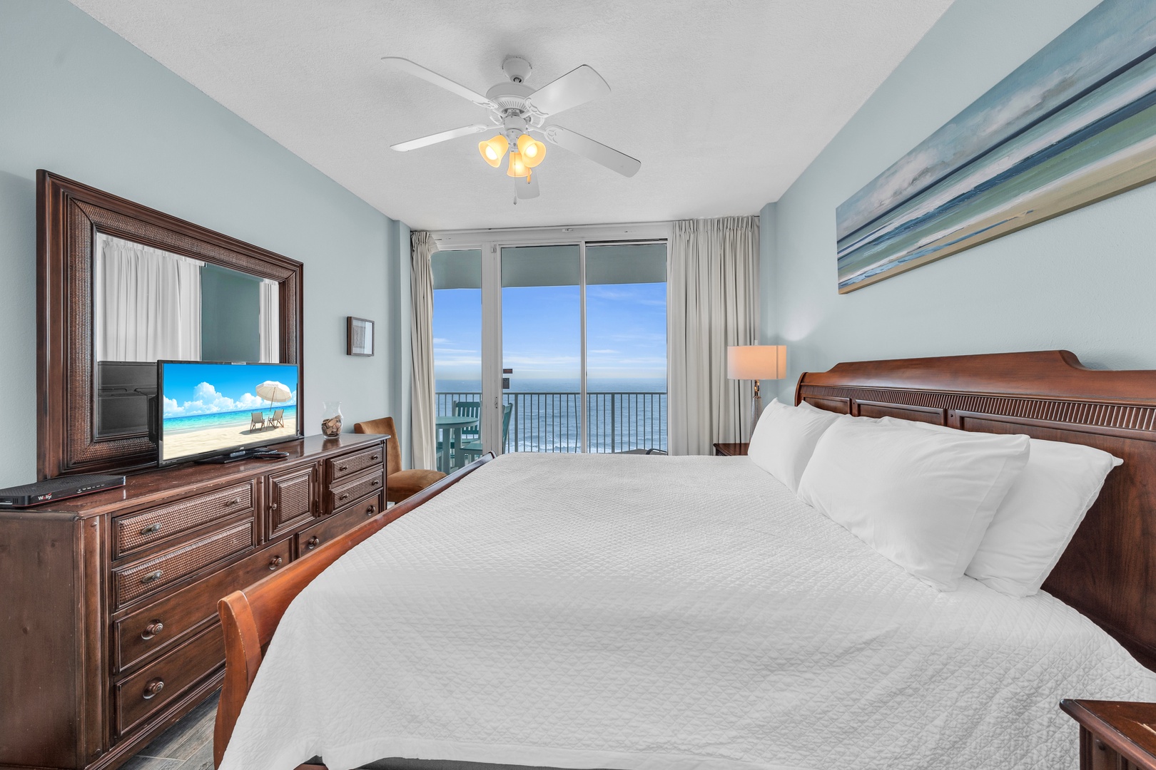 Primary bedroom with Gulf view and balcony access