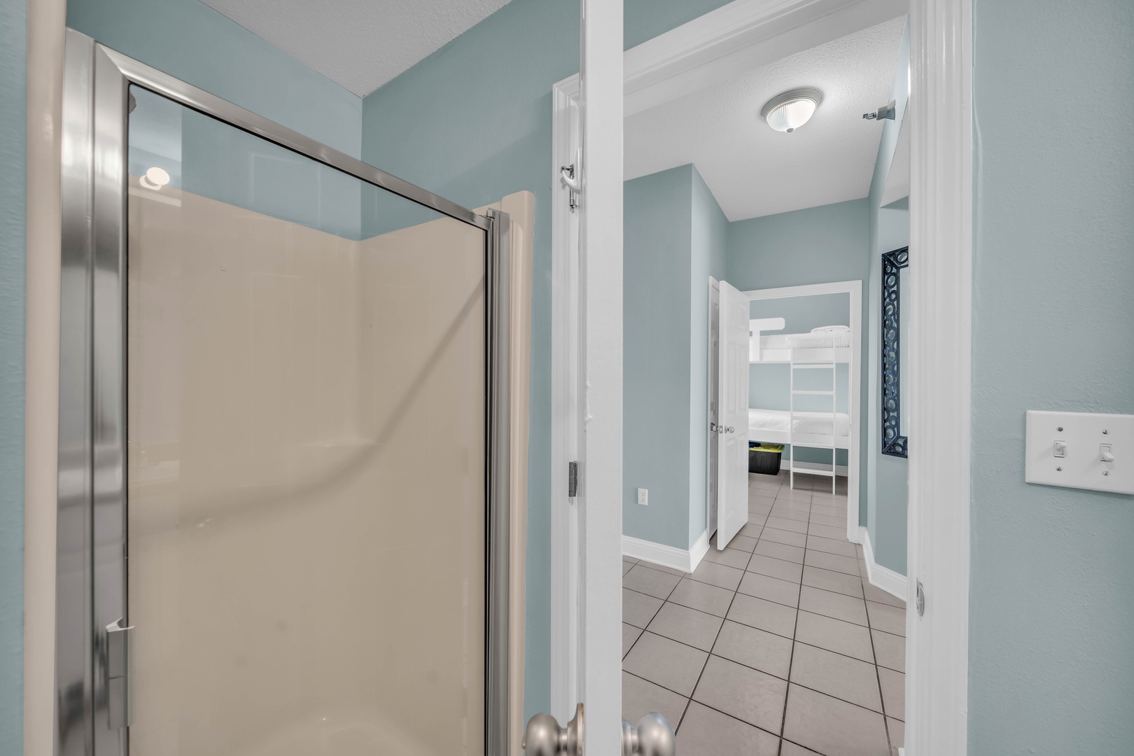 A second full bath in the hallway caters to the Bunk Room and drop-in guests.