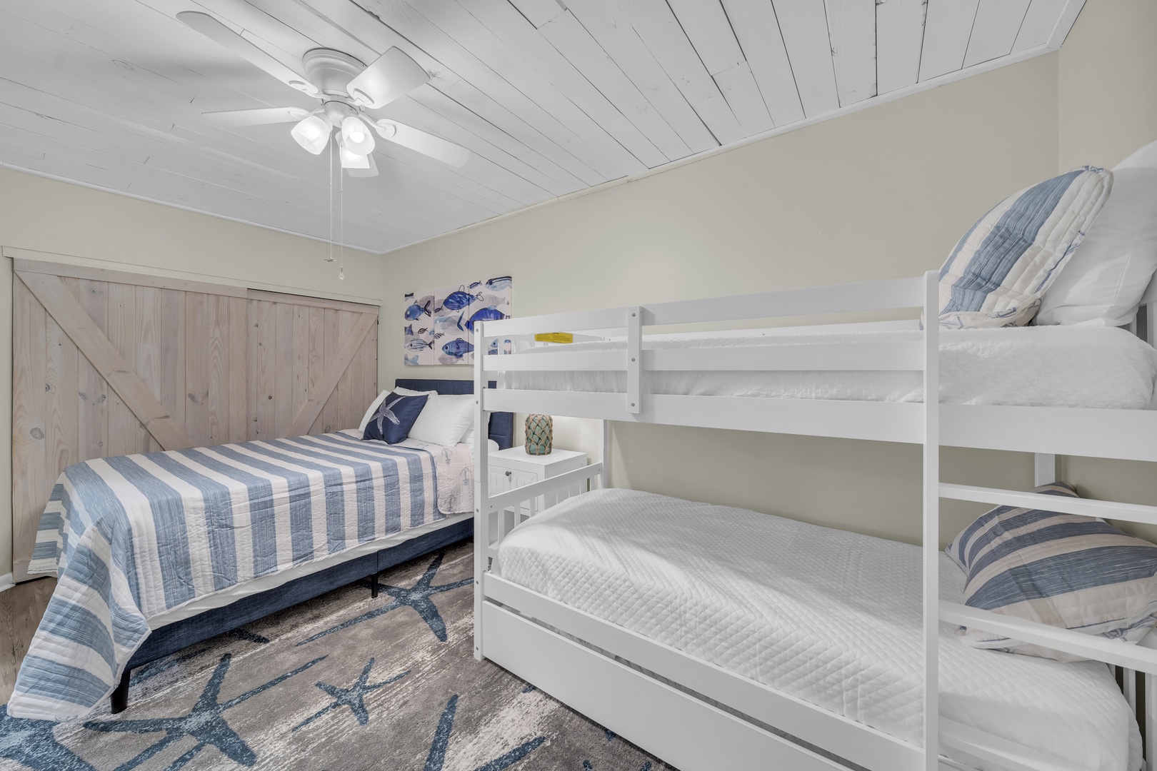 2nd guest bedroom with queens sized bed, twin over twin bunk, and trundle bed