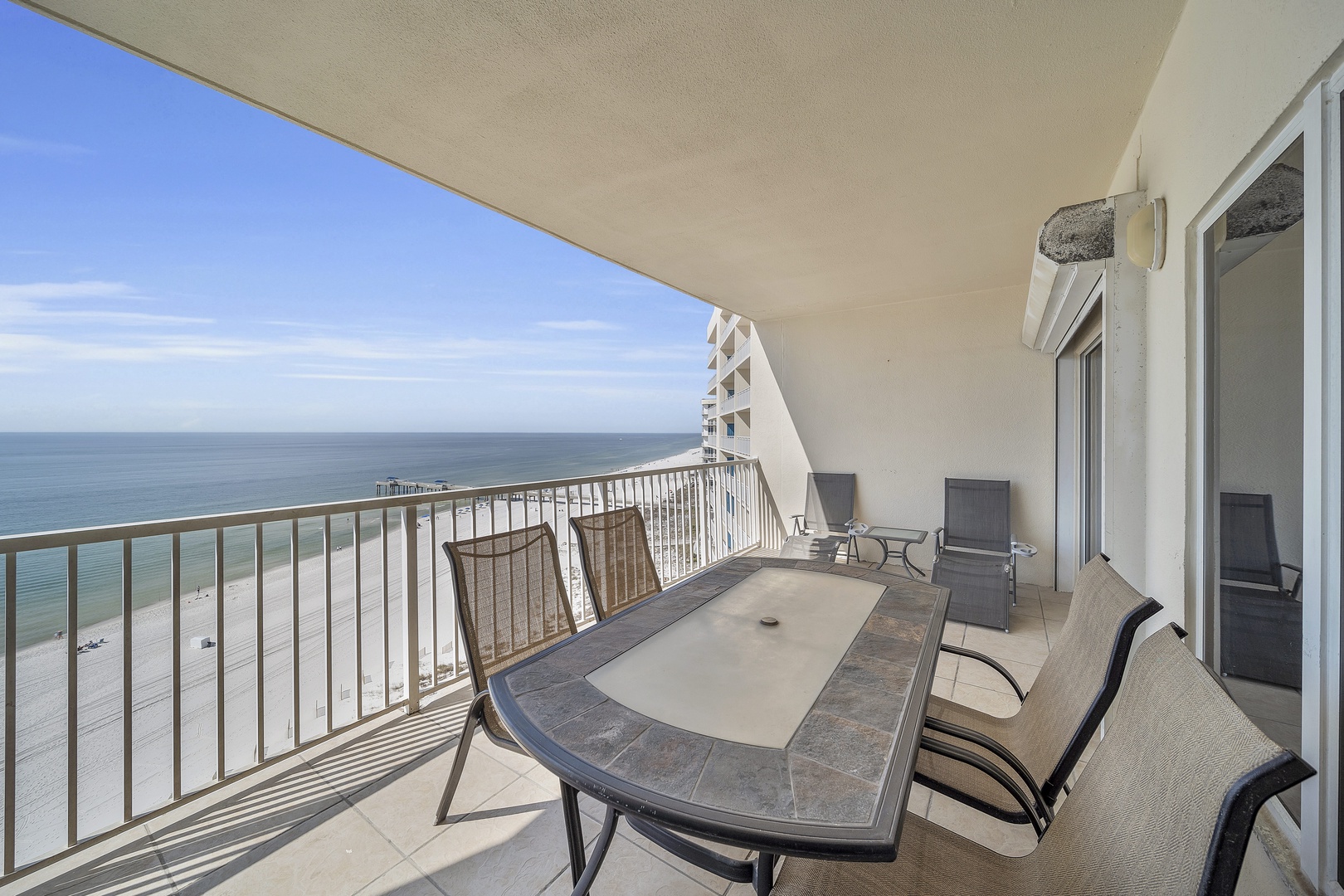 Balcony with Gulf view outdoor dining and 2 loungers