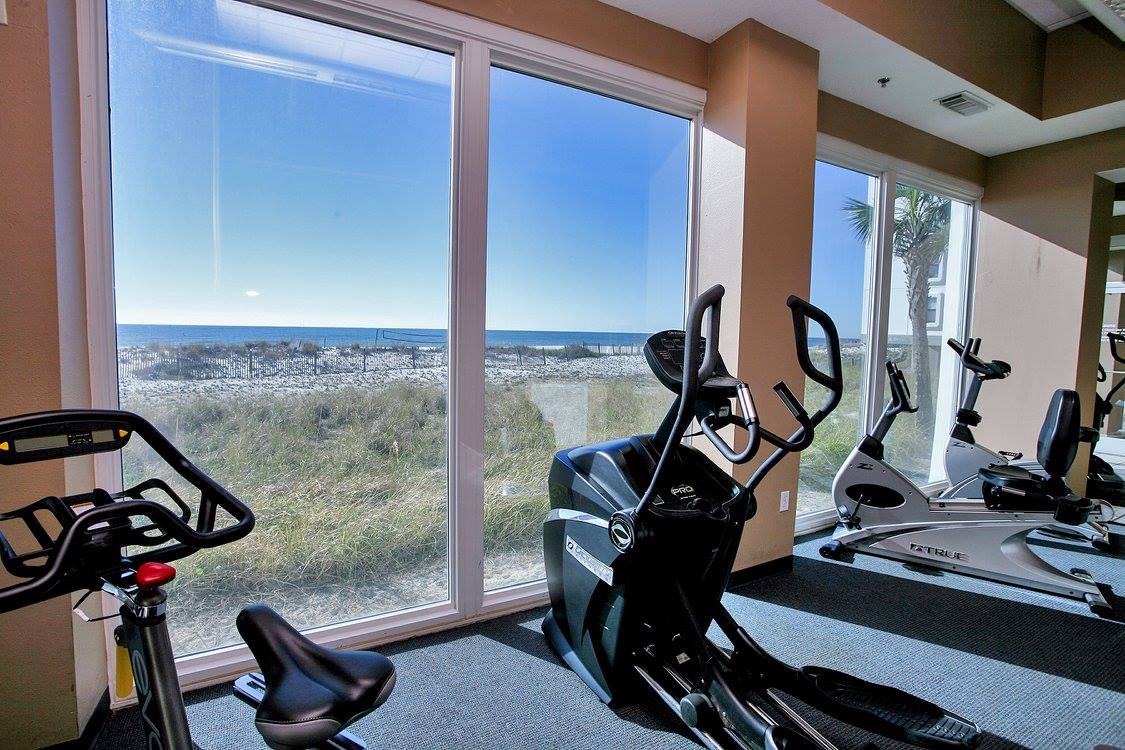 Fitness center with view of beach