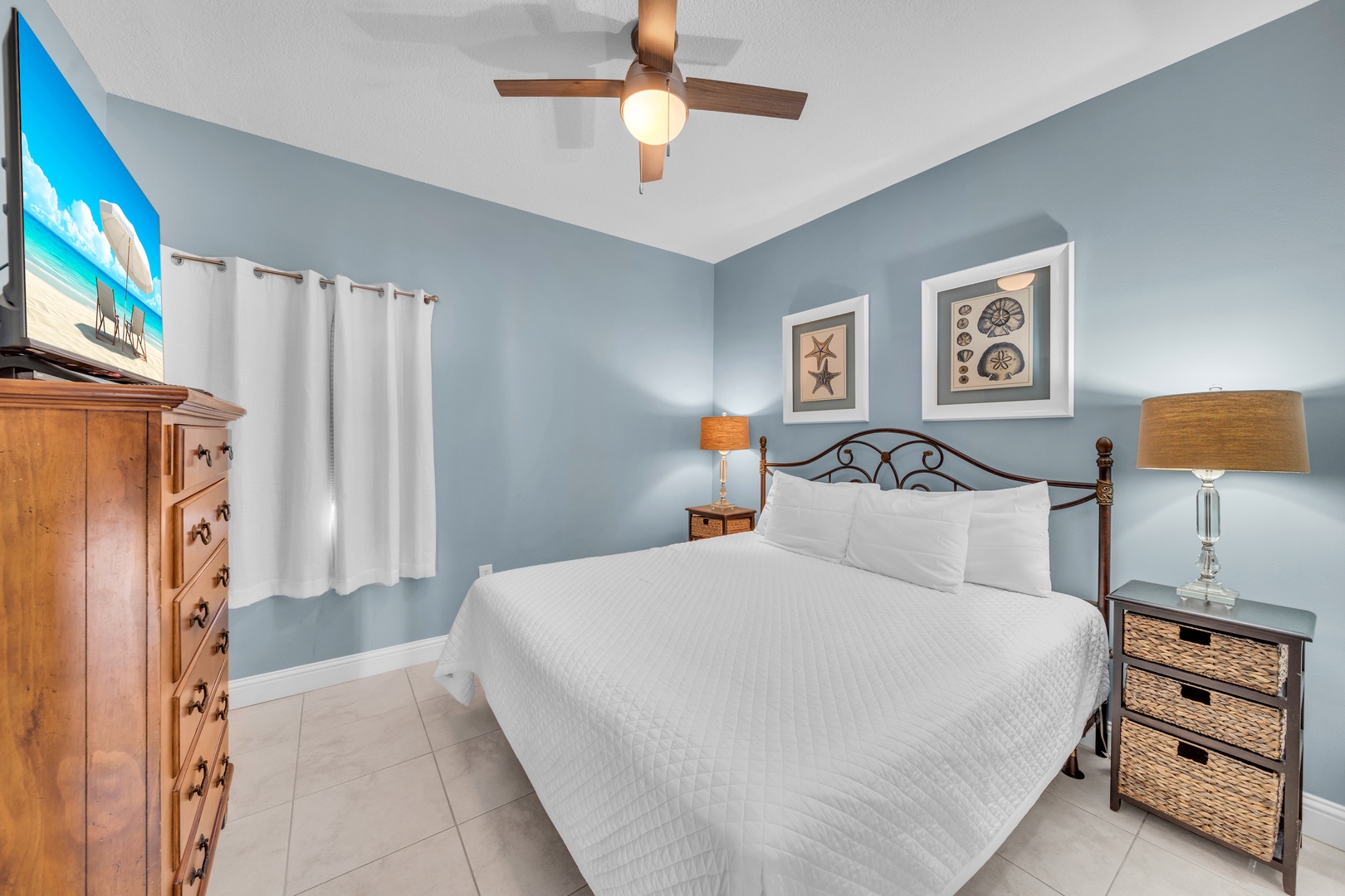 The guest bedroom echoes the luxury with its comfortable king bed.