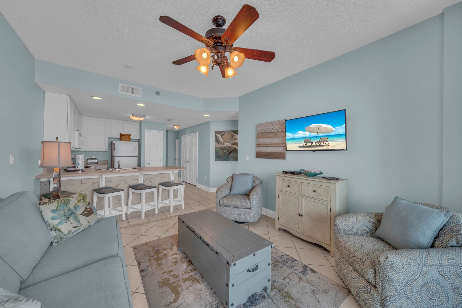 The Living Room, decorated in a Stylish Coastal Flair, welcomes you with a comfortable Queen Sleeper Sofa, an HD Flat Screen TV, and a Stereo.