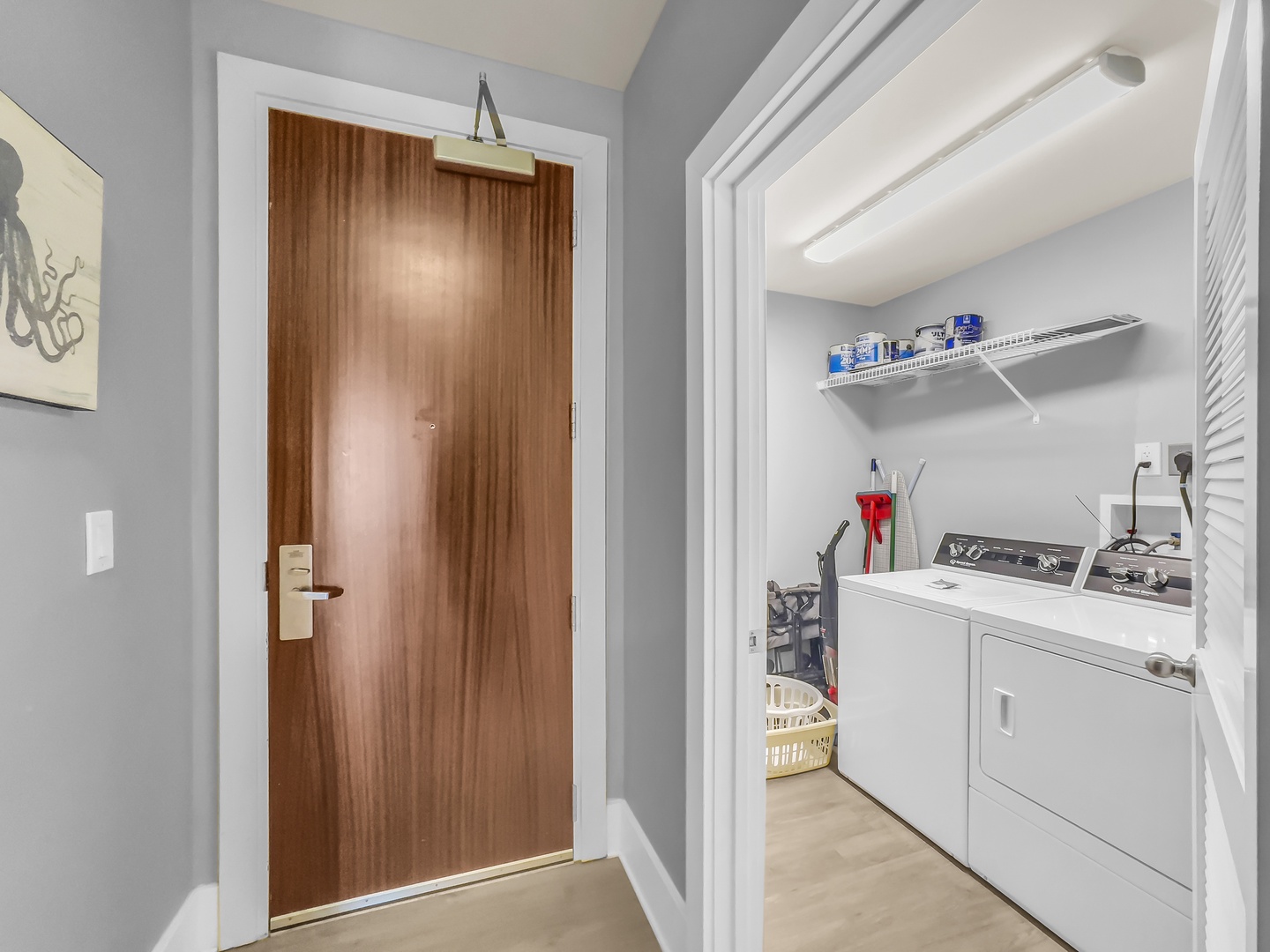 Entrance to condo and view of ensuite washer and dryer