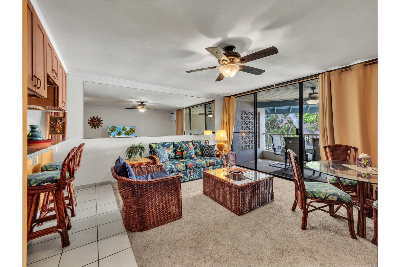 Relax in your tropical-themed living space with wicker furniture, vibrant Hawaiian prints, and sliding doors to your private lanai.