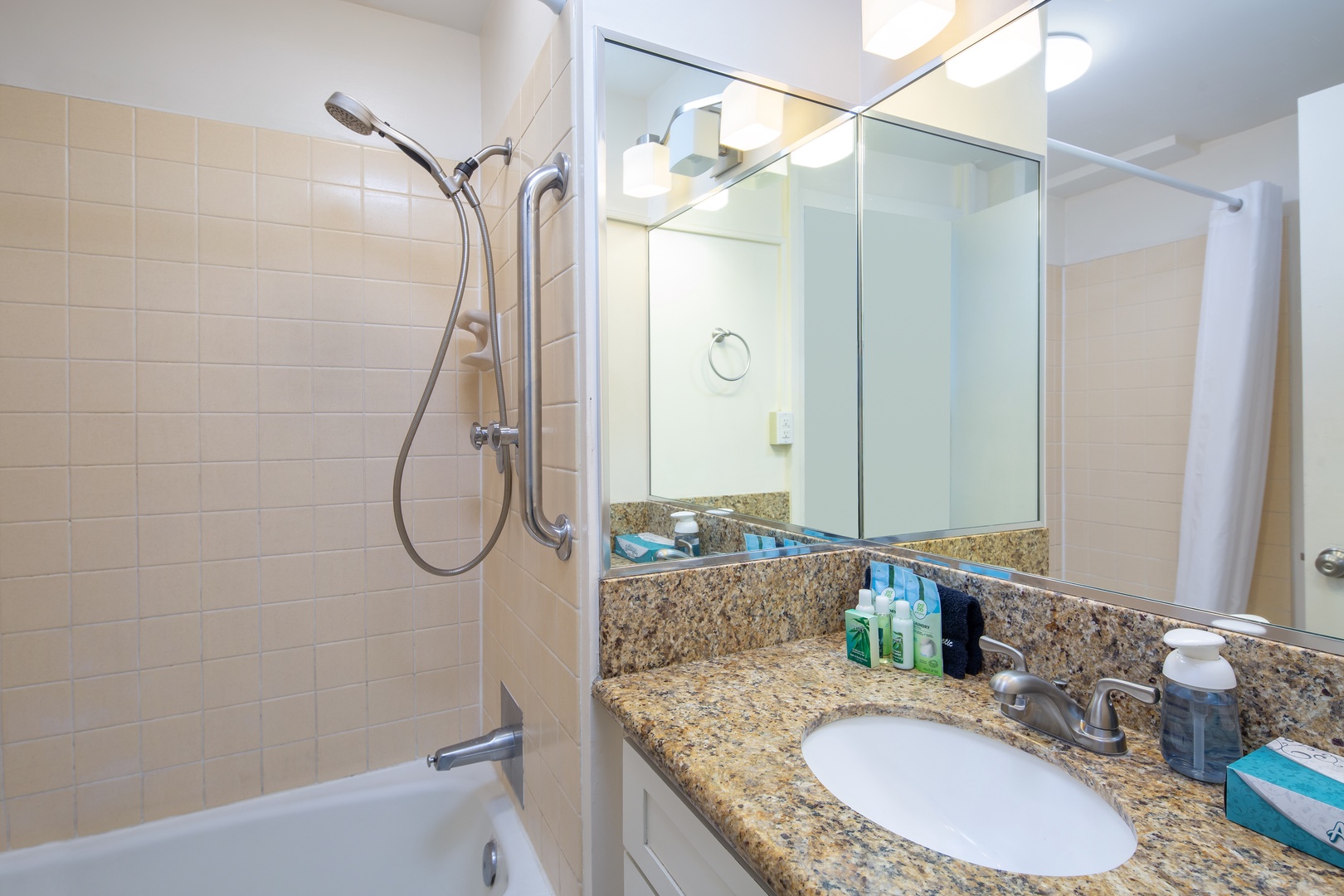 Your private bathroom features a shower-tub combo with granite countertops, quality fixtures, and complimentary toiletries—everything you need to refresh and relax after a day of exploring.