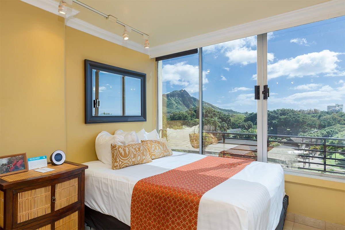 The iconic Diamond Head crater greets each morning from your window, while gentle island breezes sweep through the open balcony doors—your daily slice of paradise awaits.