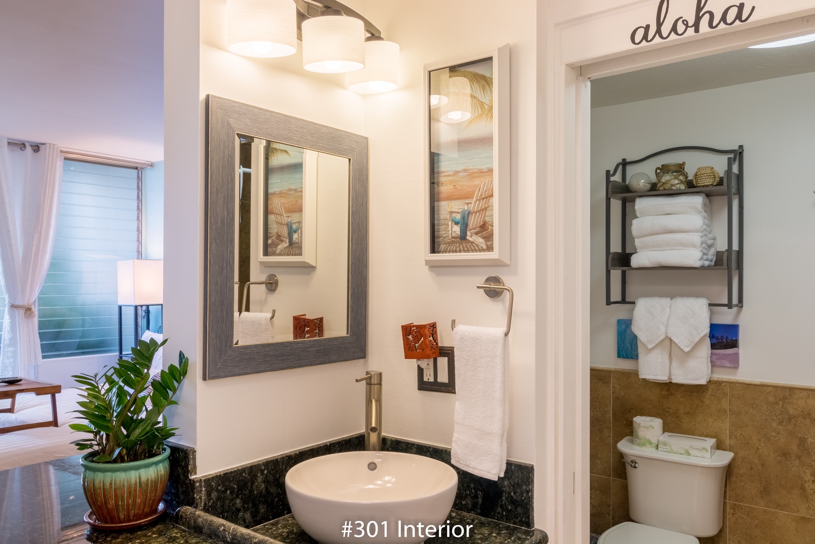 Your private bathroom features a modern vessel sink, plush white towels, and thoughtful tropical touches—everything you need to refresh and unwind in style.