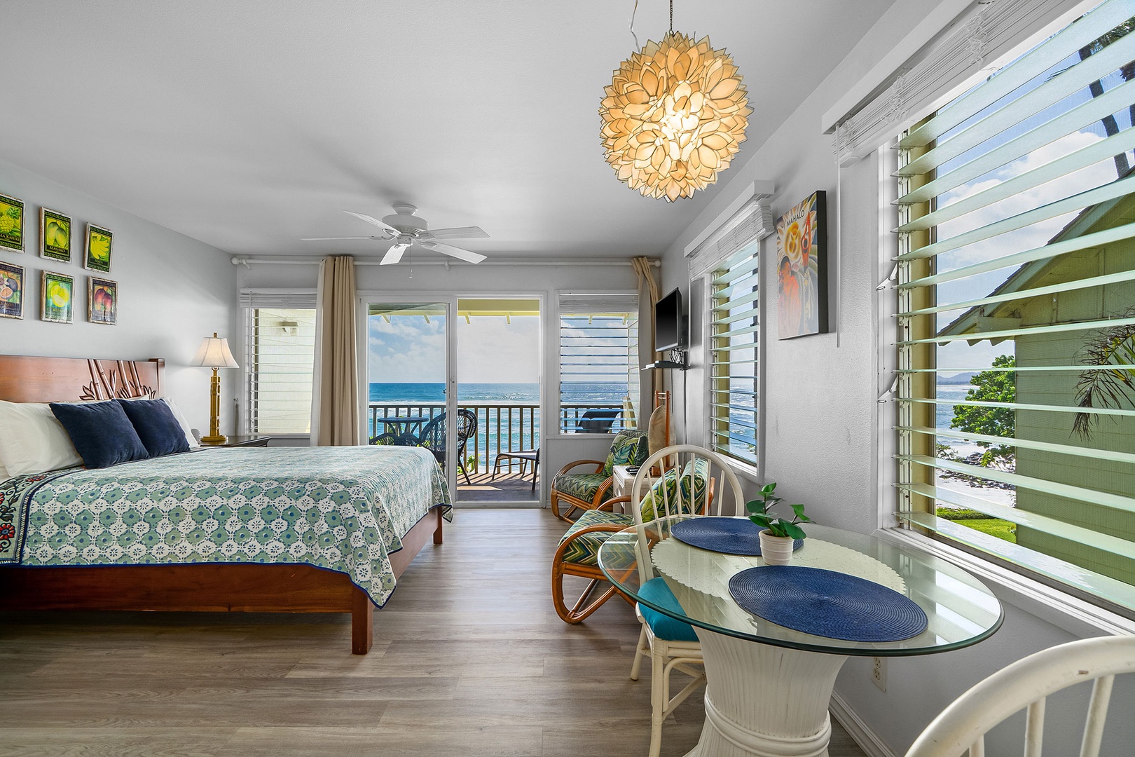 Wake up to stunning ocean views from your tropical bedroom retreat, where coastal breezes flow through plantation shutters.