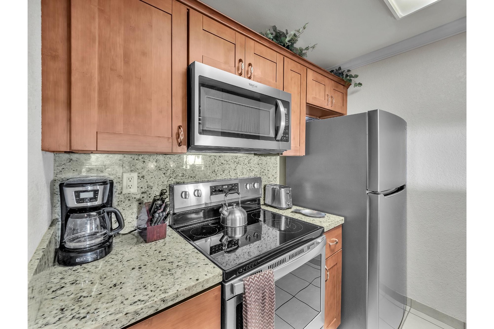 Your fully equipped kitchen features granite countertops, stainless steel appliances, and everything you need to create memorable meals during your stay.