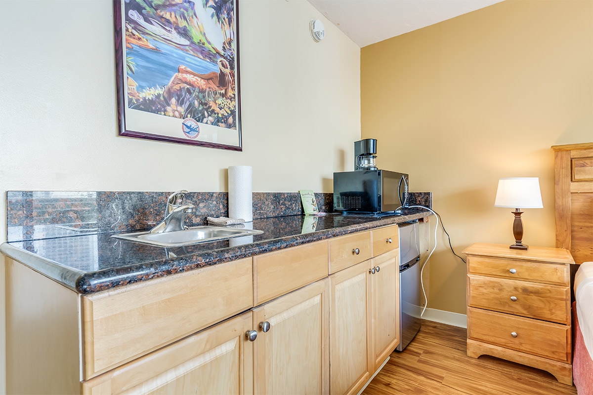 Your kitchenette features granite counters, a stainless sink, and essentials like a microwave and coffee maker—perfect for easy meal prep during your stay.