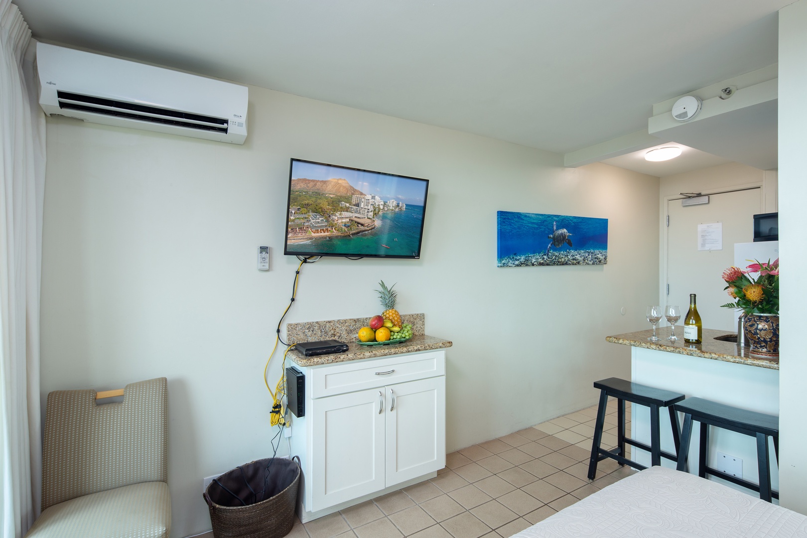 Your bright, airy studio features modern climate control, a handy kitchenette, and entertainment center—everything ready for an effortless island escape.
