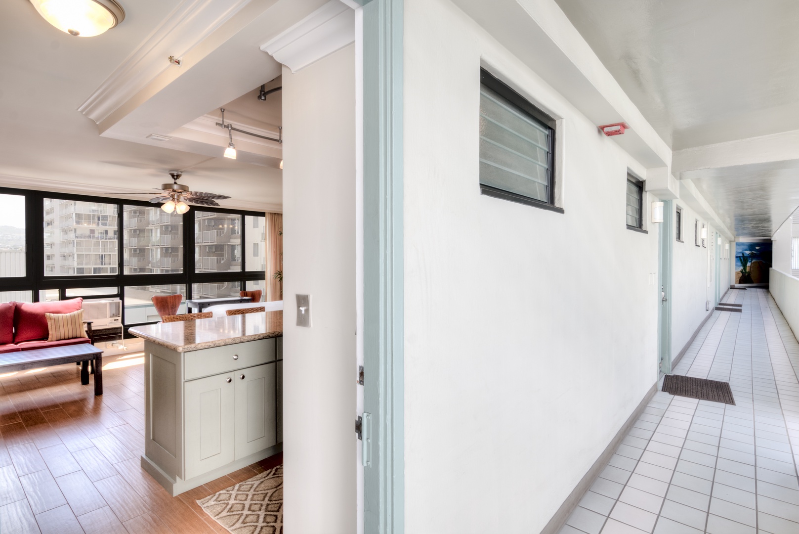 Step through your private entrance into a thoughtfully designed space where modern comfort meets bright, open living. The warm wood floors and city views welcome you home.