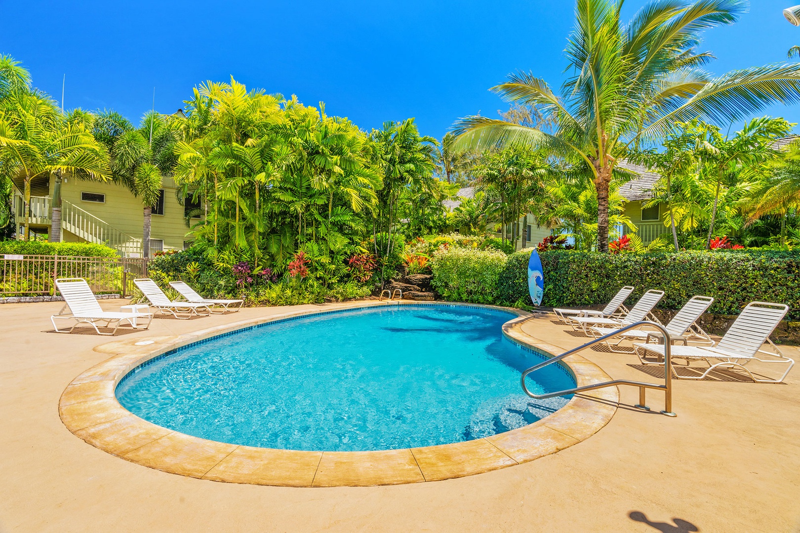 Soak up the tropical paradise at your private pool, surrounded by swaying palms and vibrant gardens under endless blue skies.