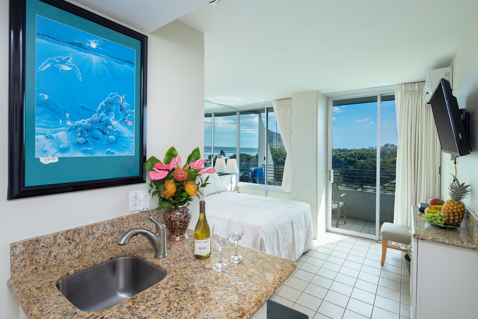 Picture yourself unwinding in this bright, breezy space with coastal charm—enjoy your morning coffee at the granite counter before stepping onto your private balcony to soak in the views.