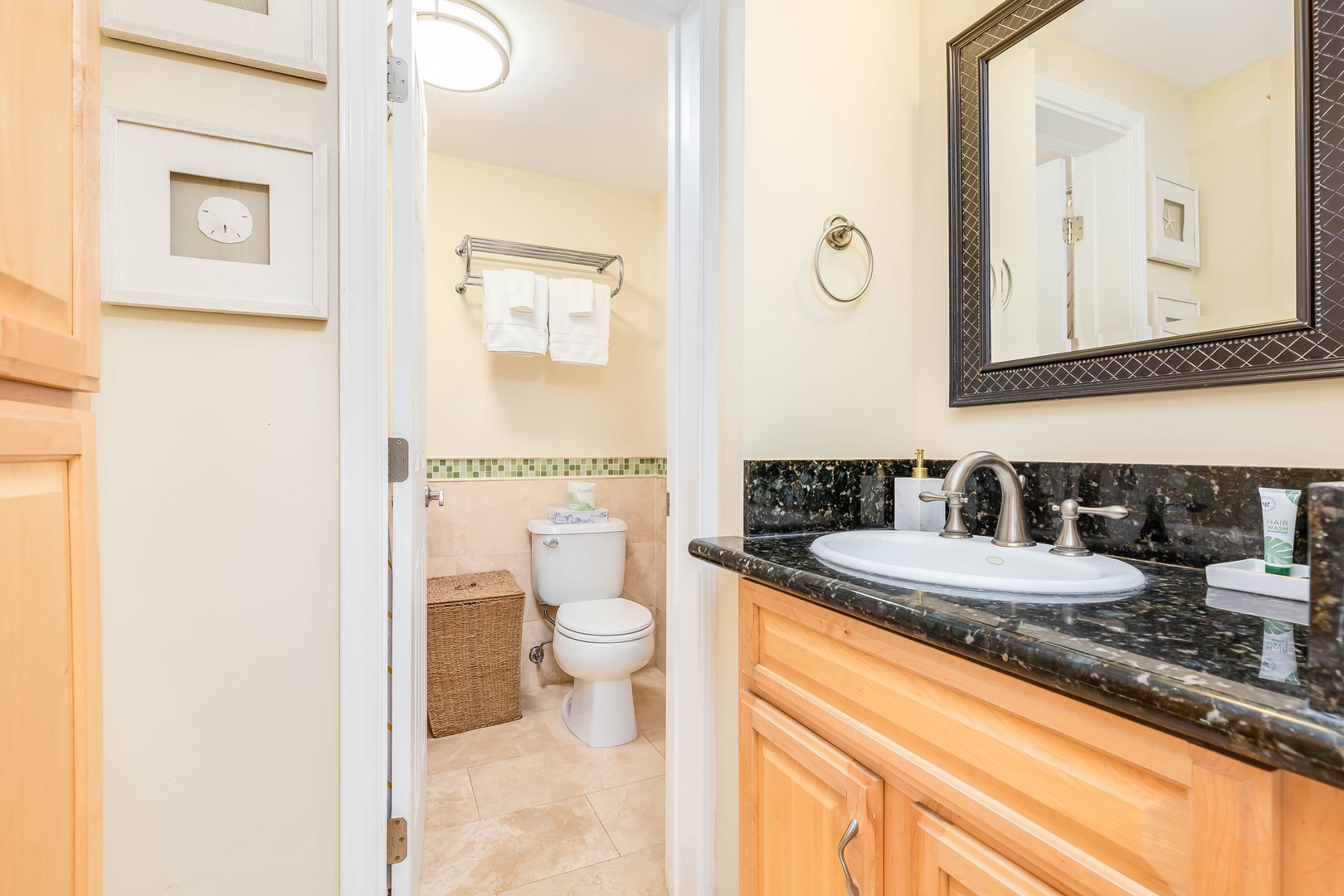 Your private bathroom features elegant granite countertops, a spacious vanity, and soft linens ready for you. Unwind in this peaceful space with thoughtful touches throughout.