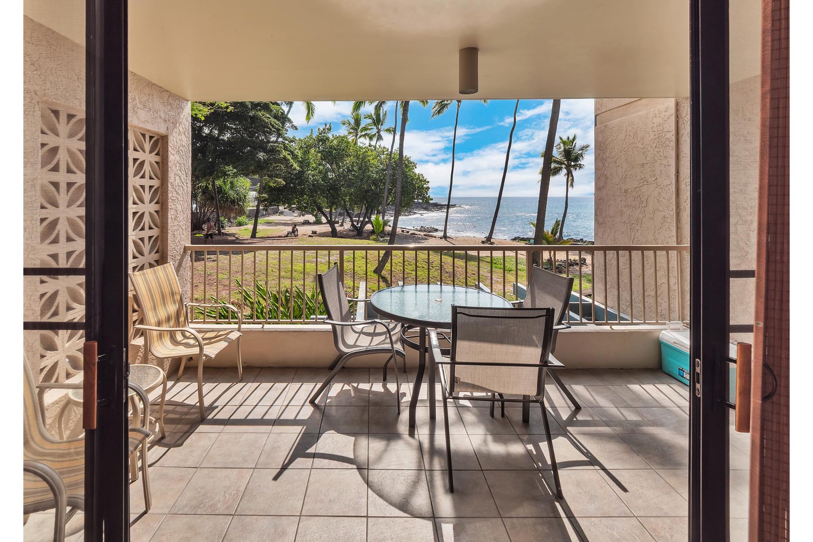 Step onto your private balcony where ocean breezes meet tropical views. Sip morning coffee while watching palm trees sway over pristine waters.