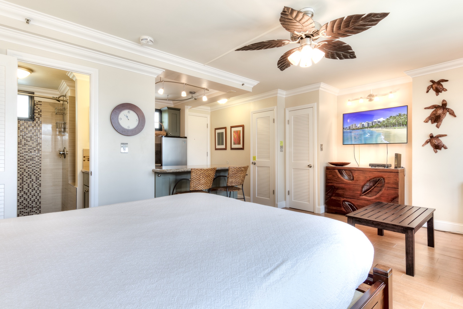 Drift off under tropical breezes in your island-themed studio, complete with kitchenette, cozy seating, and a sparkling en-suite bath just steps from your bed.