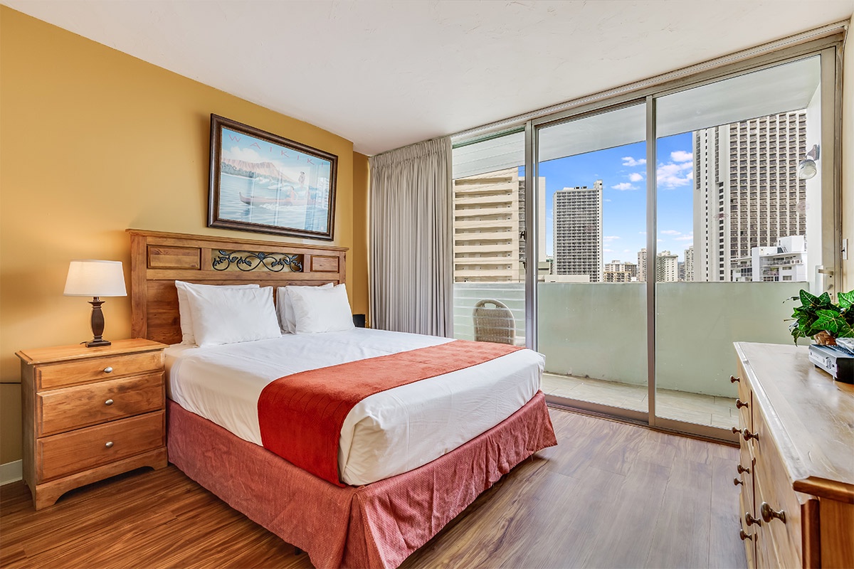 Relax in your comfortable bedroom with warm wood furnishings, crisp linens, and a private balcony overlooking the city skyline. Start each morning with natural light streaming through sliding glass doors.