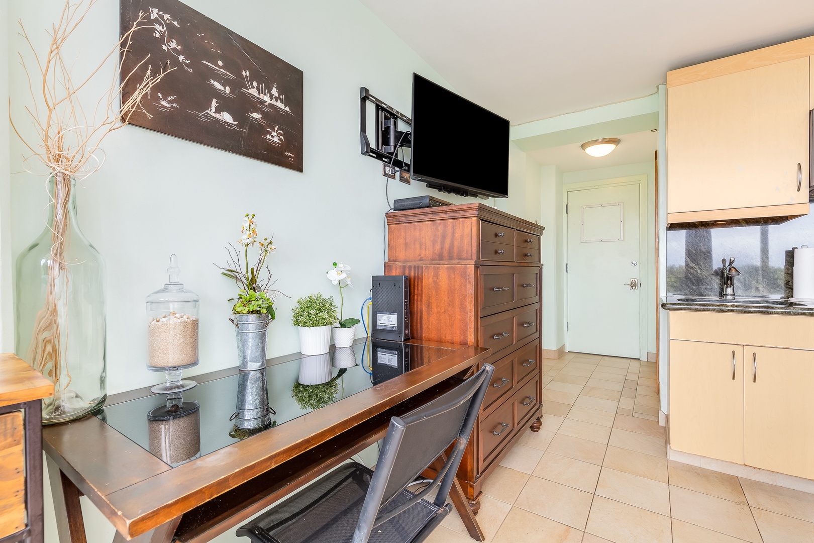 Step into your cozy home away from home, where thoughtful touches like fresh greenery and warm wood tones create a welcoming retreat after a day of adventure.