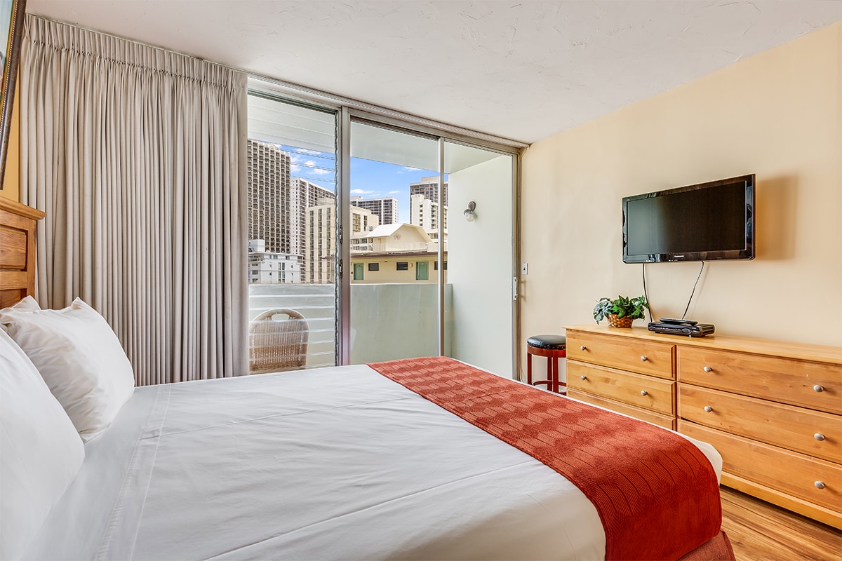 Wake up to city views from your private balcony, where floor-to-ceiling glass welcomes natural light. Crisp linens and wood furnishings create a warm retreat after exploring the neighborhood.