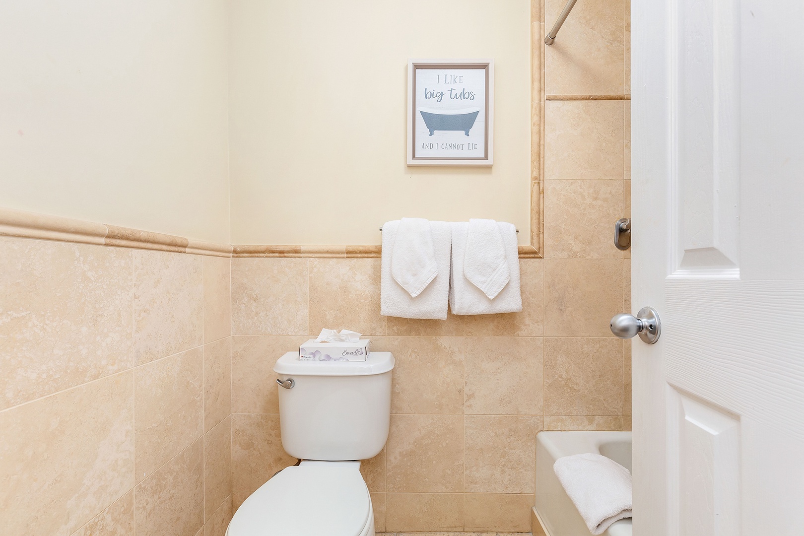 Clean, well-appointed bathroom with fresh towels and a touch of personality—your private retreat after a day of adventure.