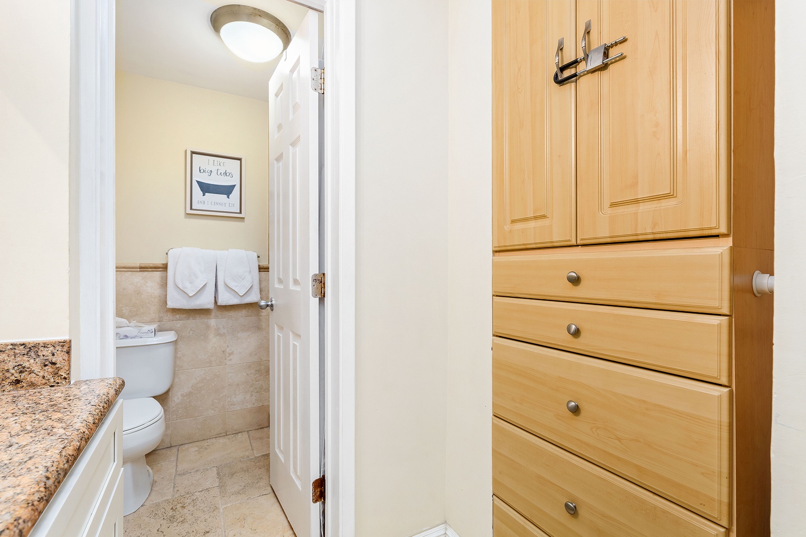 Your private bathroom awaits with fresh towels, coastal décor, and thoughtful details that make you feel instantly at home.